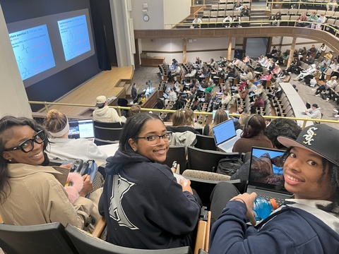 Nykara Brown, Assistant Director, Xavier Center for Teaching Excellence and Xavier Student Partners Gabrielle Clark and Christopher Saddler, Jr. observing a Chemistry class at Iowa.