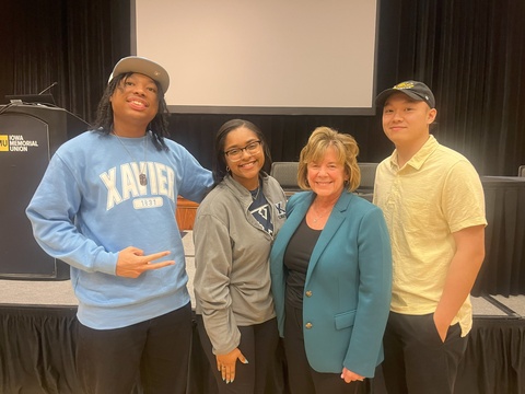 Iowa Student Partner, Harry Bui and Student Partners from Xavier University, Gabrielle Clark and Christopher Saddler, Jr., with University of Iowa President Barbara Wilson at the 1stGen@Iowa Awards and Recognition Ceremony.