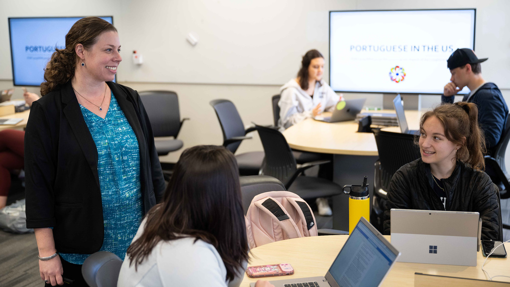 Instructor talking with students in the classroom