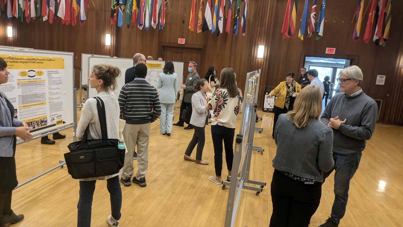 Faculty and staff at a conference poster session